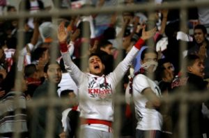 From the archive, An Ultras White Knights soccer fan cries during a match between Egyptian Premier League clubs Zamalek and ENPPI at the Air Defense Stadium in a suburb east of Cairo, Egypt, Feb. 8, 2015. (Ahmed Abd El-Gwad/El Shorouk via AP